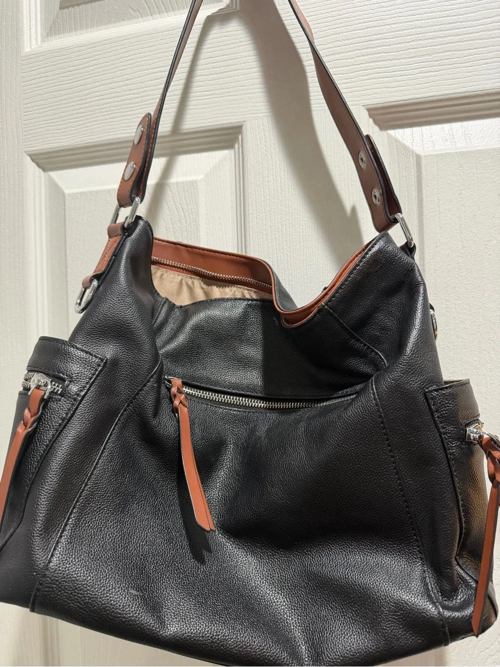Sleek Black Leather Shoulder Bag with Brown Strap